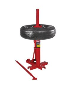 Ranger RWS-3TC 5150400 manual tire changer with a mounted tire and steel base, shown with bead breaker bar on the ground.