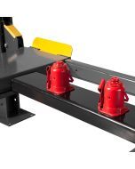 Sliding jack stand that fits between the runways of a four-post lift
