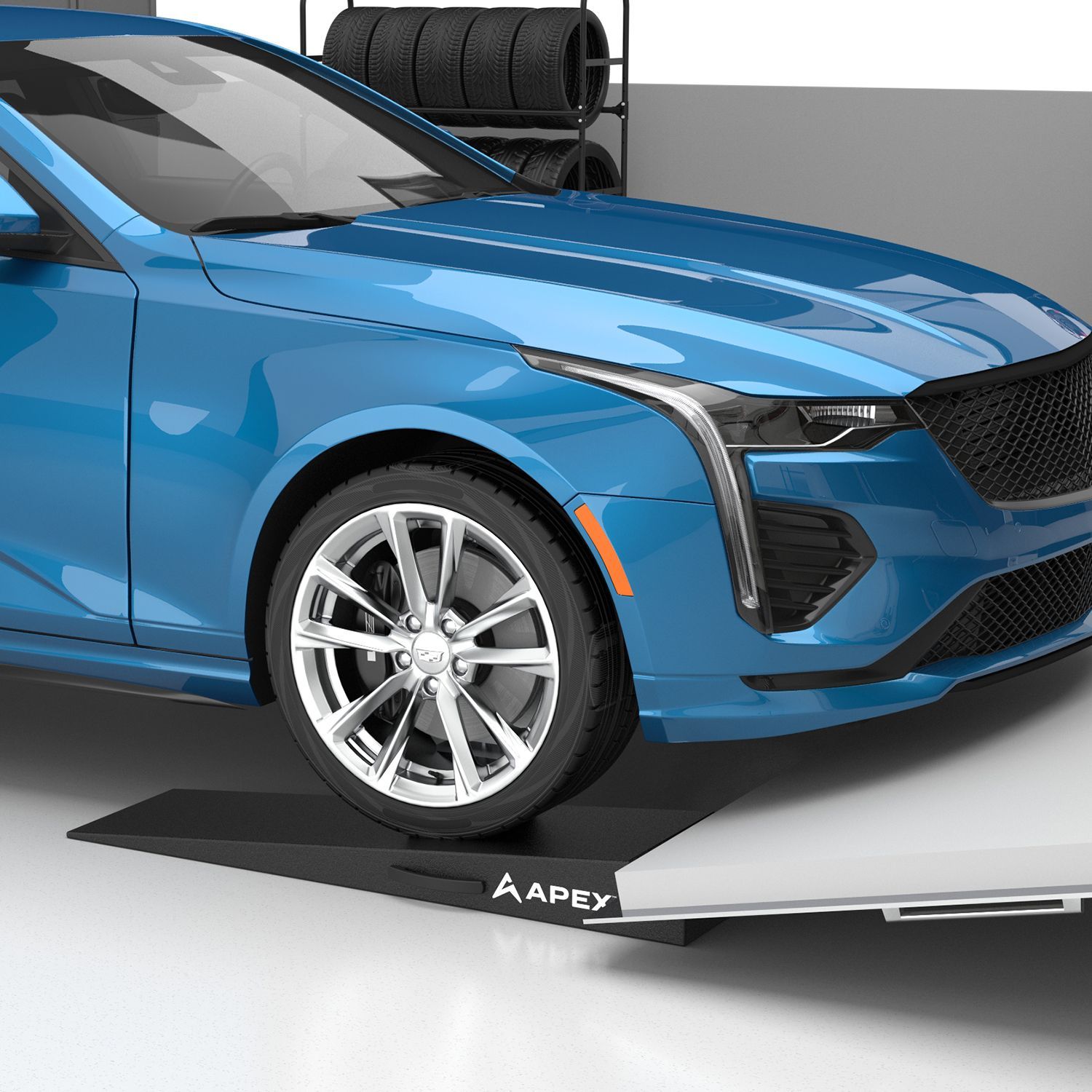 Apex lightweight foam trailer ramp supporting a blue vehicle tire, designed for low-clearance loading and smooth approach angles.