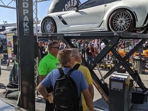 BendPak at SEMA 2019 looking at Autostacker parking lift
