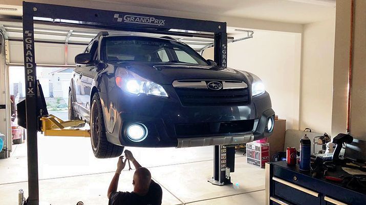two post car lift in home garage