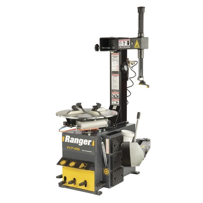  Ranger R745 manual swing-arm tire changer with yellow and black cabinet, bead breaker arm, and turntable. Designed for passenger and light truck tires, photographed against a white background.